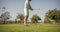 cropped male golf player on professional course with green grass, golf