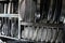 Cropped, partial and close view of kitchen utensils all together display on a residential kitchen rack.