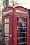 A cropped photo of a british telephone booth with an applied vintage filter