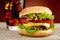 Cropped photo of cheeseburger,glass of cola on wooden table