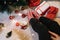 Cropped photo of Christmas presents, woman`s legs and cappuccino