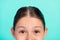 Cropped photo of cute adorable little schoolgirl lady look camera oculist clinic concept  teal color background