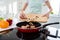 Cropped photo of housewife hands holding cutting wooden board checking meat condition adding fresh mushrooms cooking