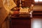 Cropped photo of priest in golden ceremonial cassock stand at lectern with books, reading pray book in orthodox church.