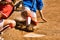 Cropped photo of softball player sliding into home plate