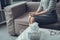 Cropped photo of woman sitting on sofa in psychology consulting room