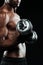 Cropped photo of young afroamerican sports man, lifting dumbbell