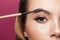 Cropped photo of young lady paint eyebrow with brush isolated