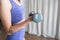 cropped picture - person holding dumbbells