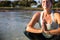 Cropped picture of woman in meditation after her SUP Yoga on the