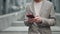 Cropped portrait of the handsome man having message phone talk outdoor. Business man chatting on smartphone at the