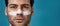 Cropped portrait of serious brunette guy with white mask applied on nose for cleansing pores looking away, posing