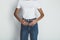 Cropped portrait of young woman in jeans and blank white t-shirt