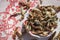 Cropped shoot of traditionally dried under sun string beans on small cup with table sheet