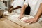 cropped shot of bakers kneading dough together