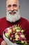 Cropped shot of bearded man with a bouquet of tulips