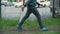 Cropped shot of boy in casual clothing running on street