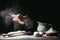 Cropped shot of chef clapping ahnds with flour before making dough