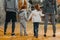 Cropped shot of family with kids holding hands and standing in a row