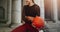 Cropped shot of a female athlete doing fitness training using a basketball. Smiling fitness woman doing workout holding a ball