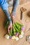 cropped shot of florist with tattoos arranging beautiful tulips