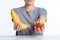 cropped shot of girl holding ripe banana and ketchup