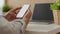 Cropped shot of male freelancer texting on blank screen smartphone while relaxed from work