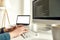 Cropped shot of male web developer writing code on desktop computer while sitting at his workplace and working from home