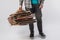 cropped shot of man holding pile of folded cardboard boxes isolated on grey, recycling concept