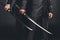 cropped shot of modern samurai with katana swords