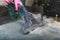 cropped shot of person cleaning sofa with vacuum cleaner hot steam