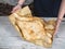 cropped shot of person wrapping delicious traditional georgian flatbreads