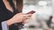 Cropped shot of professional businesswomen typing on smartphone