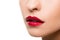 Cropped shot of sensual young woman with glossy red lips posing