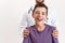 Cropped shot of teenaged disabled boy with cerebral palsy smiling at camera, standing with his male doctor isolated over