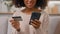 Cropped shot unrecognizable African American woman girl smile hold mobile phone pay internet order store purchase credit