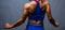 Cropped shot of a unrecognizable strong bald bodybuilder with six pack. Bodybuilder woman with perfect abs, shoulders,biceps,