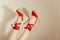 cropped shot of upside down female feet in red platform sandals