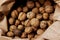 Cropped shot of walnuts. Abstract food background.  Walnuts in a paper bag.