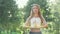 Cropped shot of a woman doing yoga vrikshasana in the park