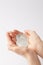 cropped shot of woman holding pile of bitcoins in hands isolated on white