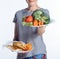 cropped shot of woman holding plates with vegetables