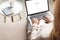 cropped shot of woman at home sitting on couch and using laptop with google website