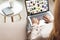 cropped shot of woman at home sitting on couch and using laptop with pinterest website