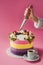 cropped shot of woman with knife, cup of coffee and decorated cake