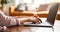 Cropped shot of woman\\\'s hands typing on laptop. Female freelancer working at her living room. Generative