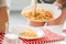 cropped shot of woman serving delicious pasta