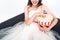 cropped shot of young bride in wedding dress eating popcorn on couch