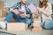 cropped shot of young couple packing books