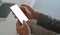 Cropped shot of A young executive holds a smartphone for online video calling in a modern personal office